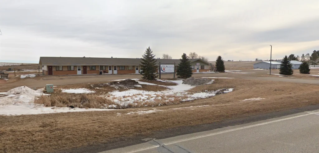 New Salem Motel by a snowy roadside landscape