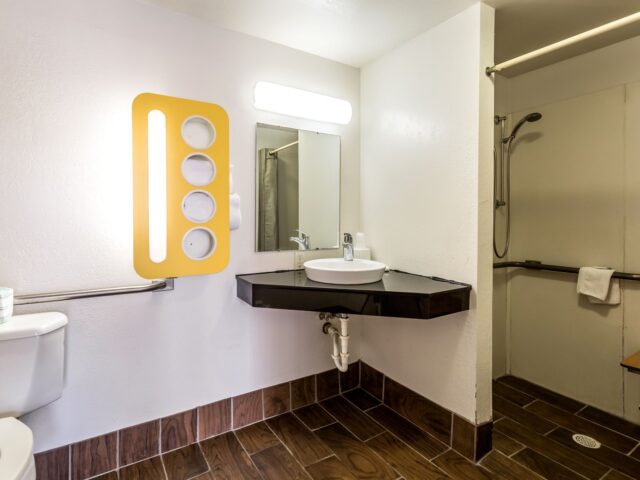 Accessible bathroom with walk-in shower at Suite Stay Evansville