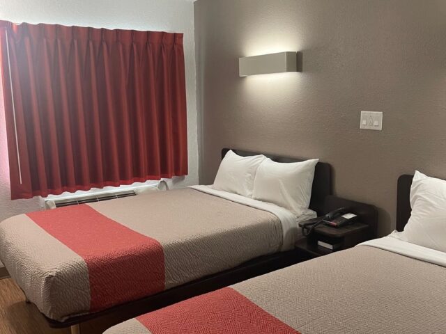 Two queen beds in a Deluxe Double room at Suite Stay Evansville