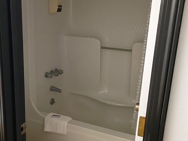 Guest bathroom with tub at The Hastings Inn Parsons, Kansas